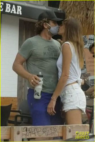 gerard-butler-kisses-girlfriend-morgan-brown-through-his-mask-03 (1).jpg