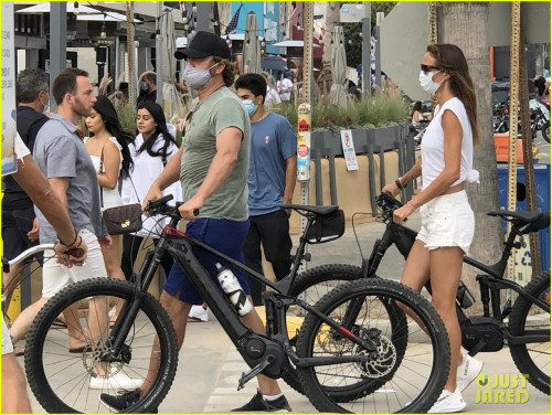 gerard-butler-kisses-girlfriend-morgan-brown-through-his-mask-06.jpg