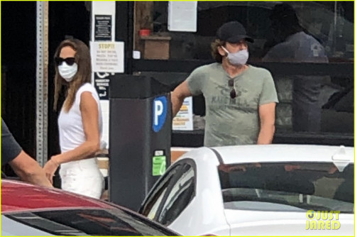 gerard-butler-kisses-girlfriend-morgan-brown-through-his-mask-08.jpg
