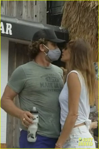 gerard-butler-kisses-girlfriend-morgan-brown-through-his-mask-13.jpg