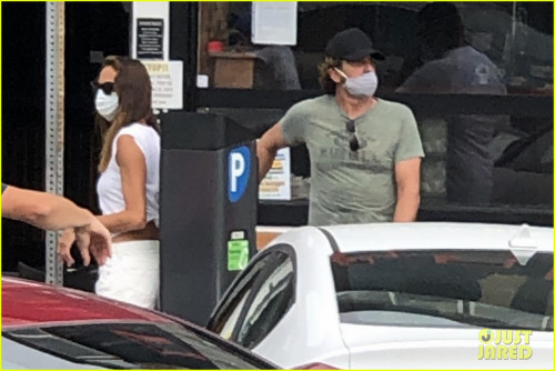 gerard-butler-kisses-girlfriend-morgan-brown-through-his-mask-17 (1).jpg