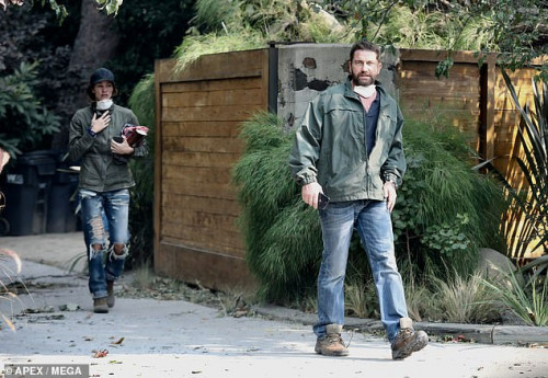 6052324-6377719-Looking_grim_Both_were_wearing_heavy_green_jackets_jeans_boots_a-a-242_1541968641907.jpg