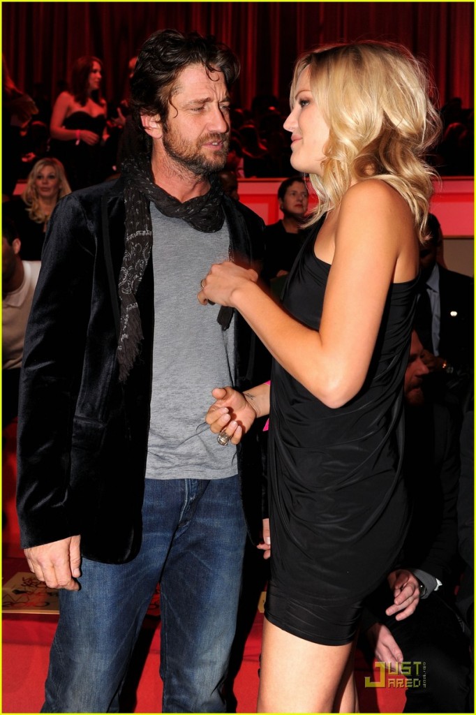 Actors Gerard Butler (L) and Malin Akerman attend the 2010 Victoria's Secret Fashion Show at the Lexington Avenue Armory on November 10, 2010 in New York City.