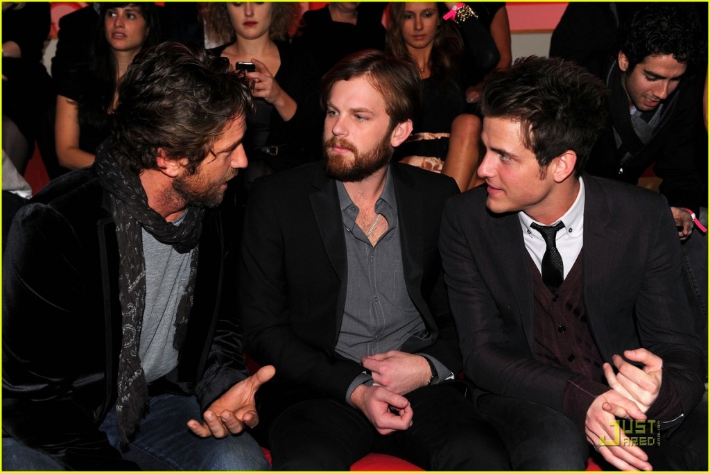 Actor Gerard Butler and musicians Caleb Followill and Jared Followill of Kings of Leon attend the 2010 Victoria's Secret Fashion Show at the Lexington Avenue Armory on November 10, 2010 in New York City.